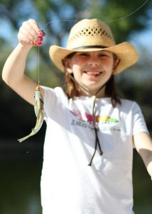 little girl shows off her big catch